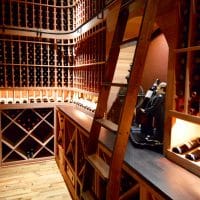 Inside a Dallas-Fort Worth Home, this wine cellar had lighting to showcase the valuable wine and beautiful decorations. Lighting, colors, and decoration choices all spur emotion, which is what increases a home\'s value when someone resales.