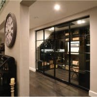 Custom Traditional Wine Cellar with Bronze Doors