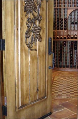 Check out our gallery of wine cellar doors we had installed for our clients. wooden-wine-cellar-door-custom-iron-decoration