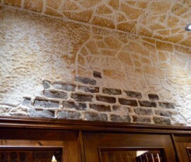 Detailed Wall Above the Wine Storage Adds Emotional Resale Value Because it Is Personal