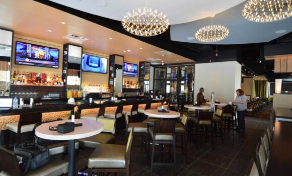 A custom commercial wine cellar Adds to the luxurious ambiance at Jasper's Restaurant at Citylinein Richardson, Texas.