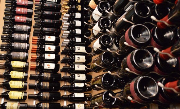 A Custom Commercial Wine Cellar Needs Quality Wine Racks. Jasper's Restaurant at Cityline in Richardson Texas Chose Wall Mounted Racks and Floor to Ceiling Racks, Keeping Their Wine Safe and Accesible