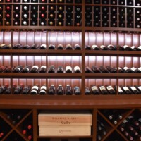 The walls behind the wine rack (which you don't see) is also covered in Sapele Mahogany .