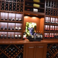 The entire custom wine rack of this Dallas residential wine cellar was made from Sapele Mahogany, one of the most high-end, expensive varieties of wood.