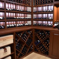 The client wanted a more versatile racking design to make it look more interesting. So we did a couple of changes to our original traditional residential wine cellar design.
