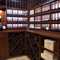 In this Dallas residential wine cellar, LED puck lights were also installed on the ceiling together with the cooling unit.