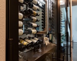 We used insulated glass doors for this transitional wine closet to give the owners and their guests a full view of the collection.
